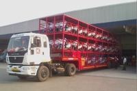 川崎汽船、インドで2輪車3段積シャーシによる近距離シャトルサービスを開始 画像