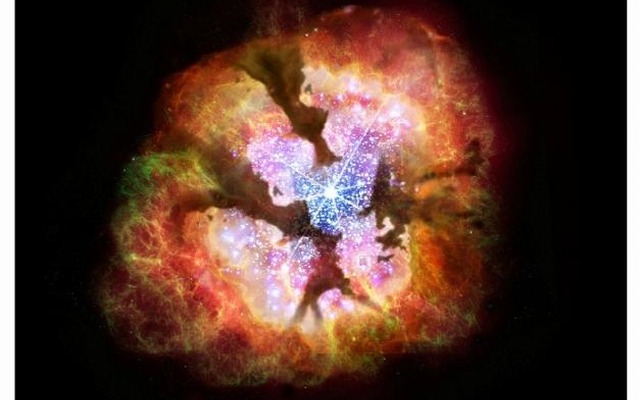 今回発見された「塵に埋もれた巨大星団」のイメージ図。中心では中質量ブラックホールが生成されると考えられる