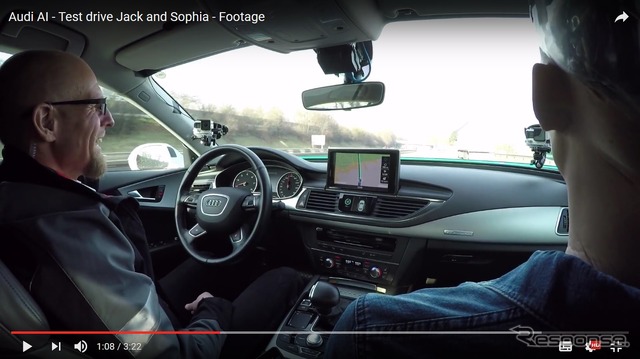 A7スポーツバックベースのアウディの自動運転開発プロトタイプ車が、女性AI(人工知能)ロボットを助手席に乗せて、高速道路でテスト走行
