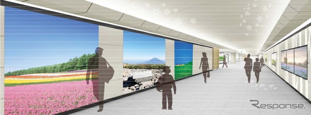 新千歳空港ターミナルビル～新千歳空港駅間の連絡通路もリニューアル。壁面には北海道をイメージしたシートを配置し、広告の周囲に白樺をイメージした装飾を施す。