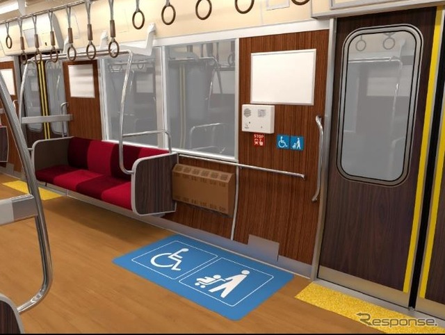 床面にピクトグラムを表示した「車いす・ベビーカースペース」。
