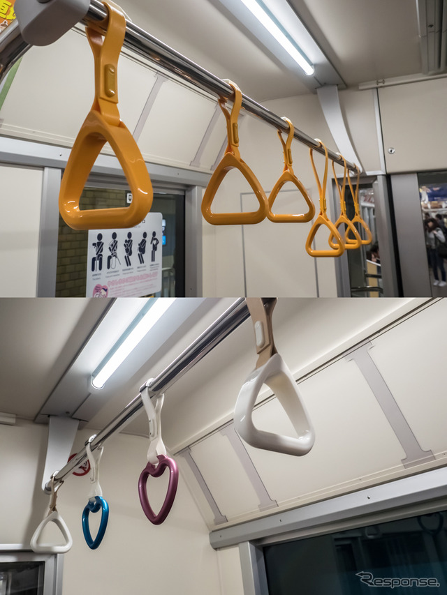 優先席付近にある高さが異なる吊革(上)。反対の車椅子スペースの吊革の一部には下のようなハート形の吊革も。