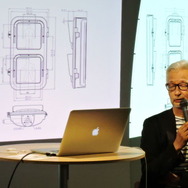 秋田氏の講演。スクリーンに映るのは歩行者用信号機の図面