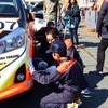 モータースポーツフェスタ2016inAUTO POLIS。PIT体験をする子供。なかなか手際が良い。