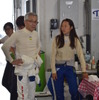 “日本一の女性ドライバー”と名高い小山美姫選手と談笑するTAOレーシング・高橋代表