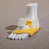 「あしらせ」のデバイス。黄色の部分は靴の中に取り付ける立体型のモーションセンサー付き振動デバイスになっている。