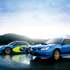 スバル インプレッサWRC2006 プロトタイプ（左）／ セダン WRX STI（右：2代目、2006／BBS製鍛造17インチアルミホイールはメーカー装着オプション）