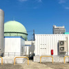 導入したAEM水電解装置と水素タンクの全景