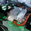 日産 マーチ試作車に搭載されたジヤトコの超小型eアクスル（コンセプトモデル）。グリーンのLED証明でライトアップ