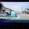 前の軽トラックが「荷捌き」のスタンプで停車理由を示す