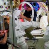 ISSで船外活動ユニット（EMU）を確認するEVAクルー（12月18日撮影）（出典：AXA／NASA）