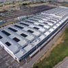 南栗橋車両管区の工場棟。屋根に4720枚の太陽光パネルが設置され、このほど東武南栗橋太陽光発電所として発電を開始した。