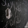 銃弾の穴の空いた黒板（シリア国内）